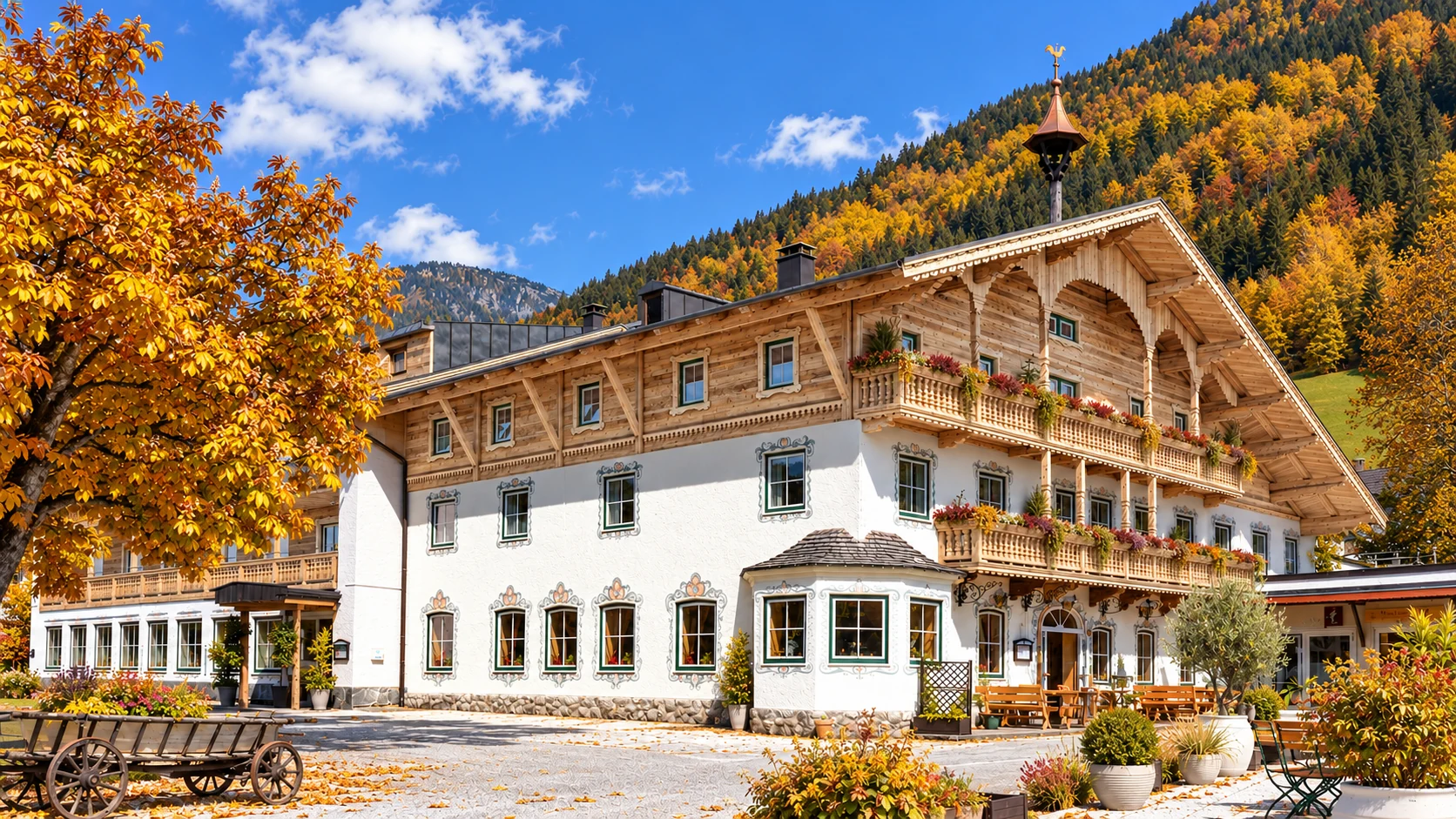 Herbstliche KI-Visualisierung der Alpenlodge in Thiersee mit goldenen Bäumen und Holzfassade